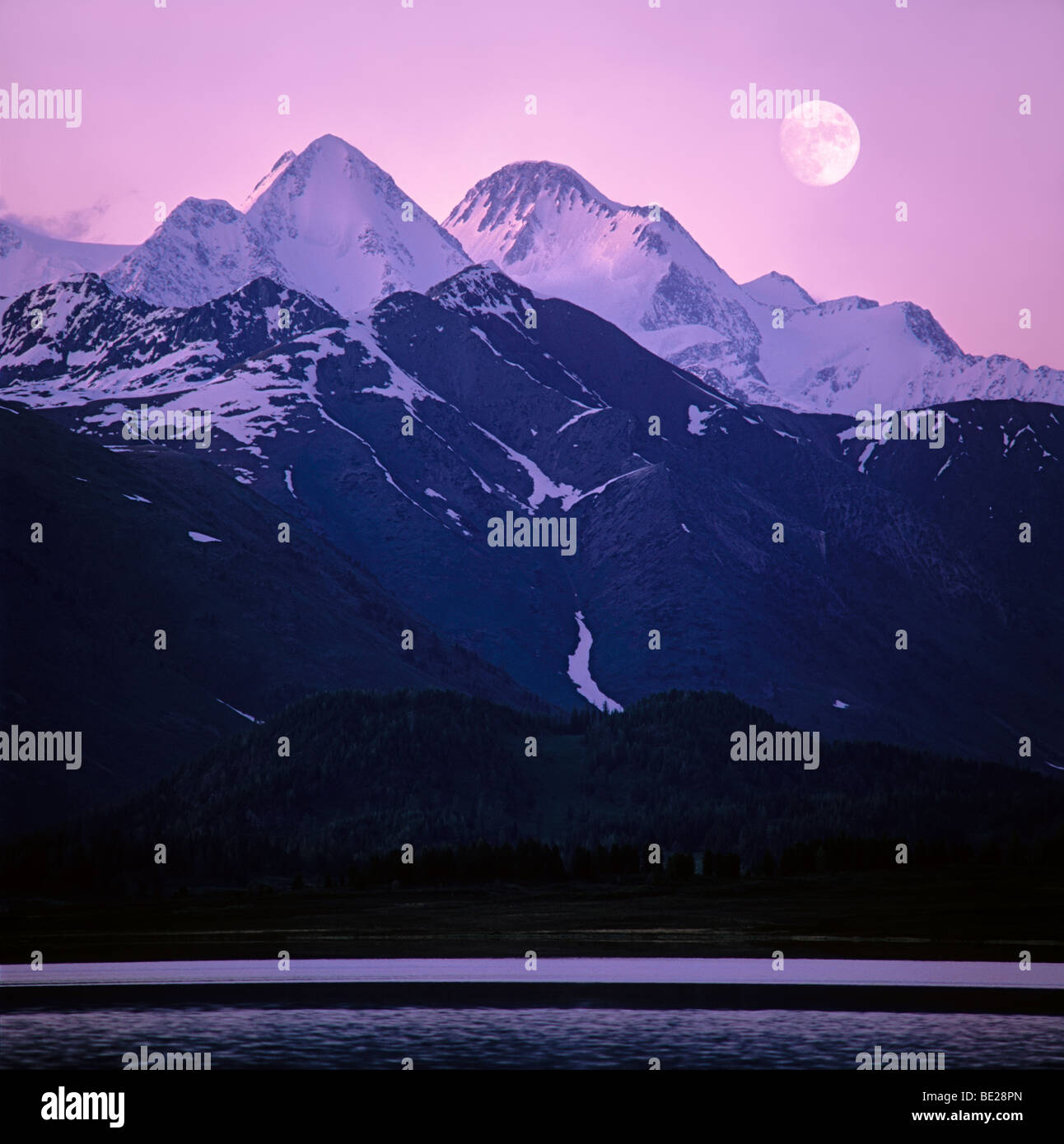 The Moon rises above Mount Belukha and the Katun Ridge. The Altai ...