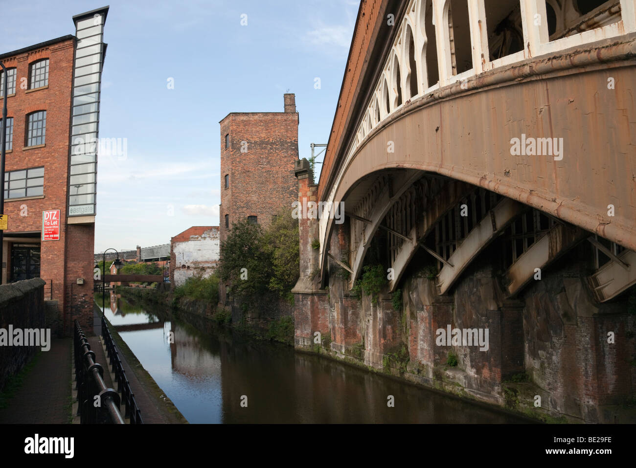 Manchester, England, UK, Europe. Rochdale canal and Victorian railway bridge in Castlefield Urban Heritage Park Stock Photo