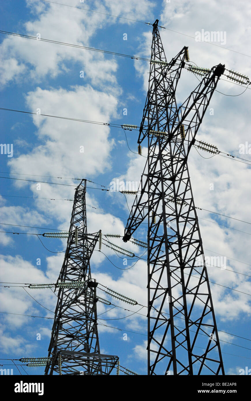 High voltage powerline over blue sky Stock Photo Alamy
