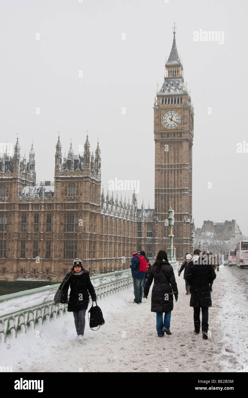 Tourists walk through heavy snow on Westminster Bridge near Big Ben
