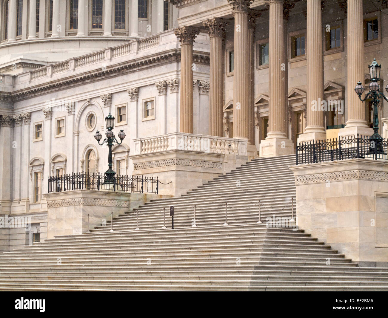 US Capitol steps. Snow flurries. Stock Photo