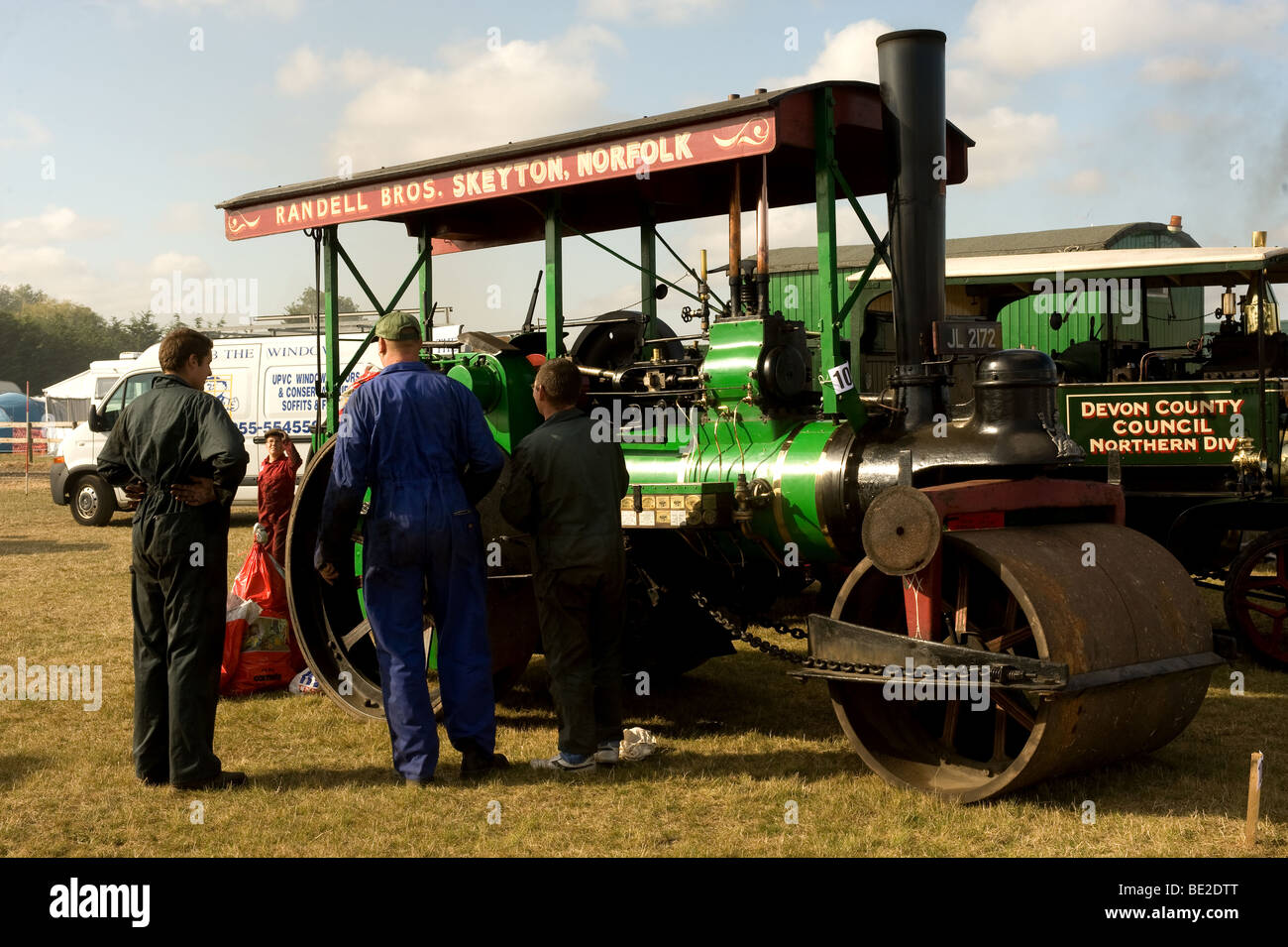 Three enthusiasts examining a steam roller at the Essex County Show.  Photo by Gordon Scammell Stock Photo