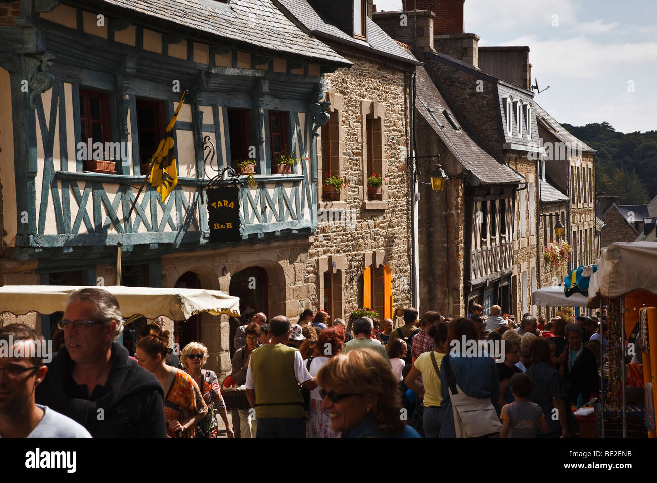 Crowds throng the narrow streets of the old town on market day at Tréguier, Côte d’Armor, Brittany, France Stock Photo