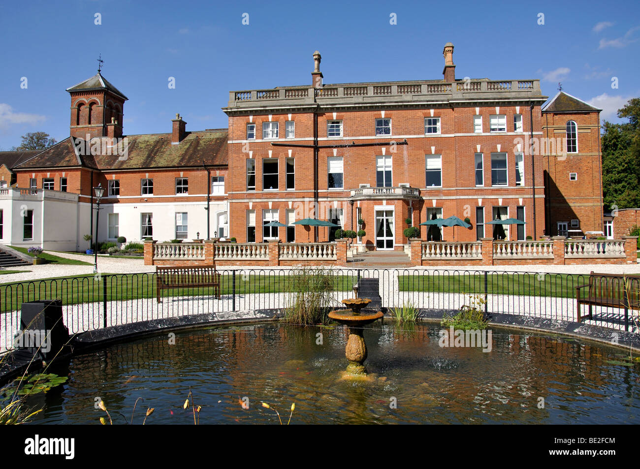 Fountain and gardens, Oakley Hall Country House Hotel, Rectory Road, Oakley, Hampshire, England, United Kingdom Stock Photo