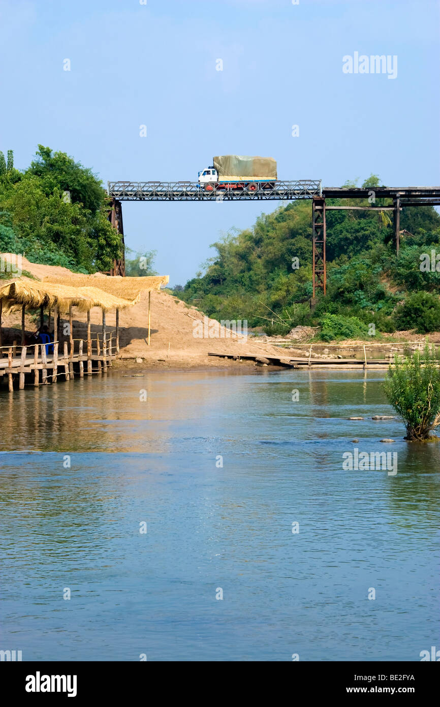 Metal bridge bending under the weight of a Heavy Lorry, Kampi, near Kratie,  Cambodia Stock Photo - Alamy