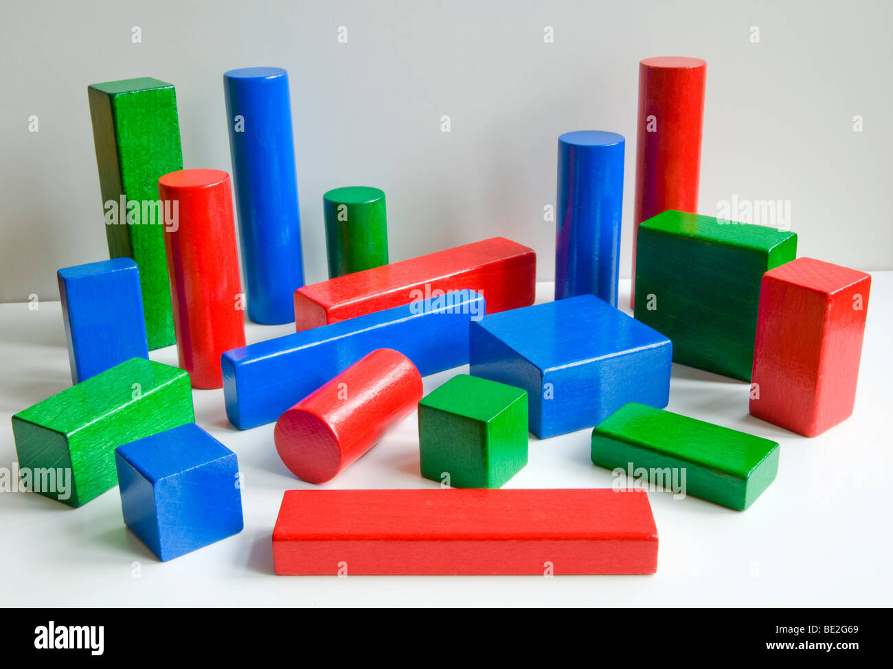A variety of coloured wooden 3D shapes Stock Photo