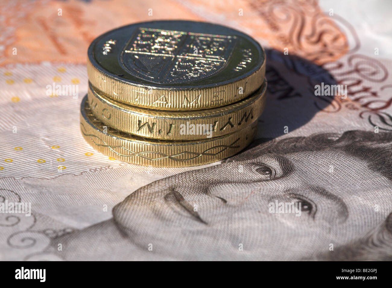 English banknote with pound coins Stock Photo