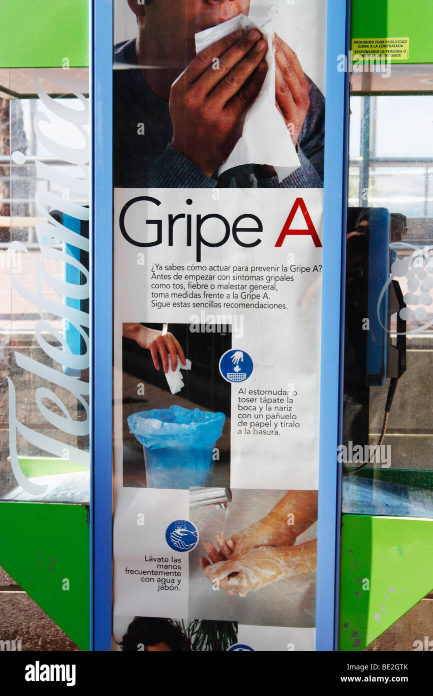 Public information poster on phone box in Spain explaing how to reduce the spread of swine flu, (Gripe A in Spanish). Stock Photo