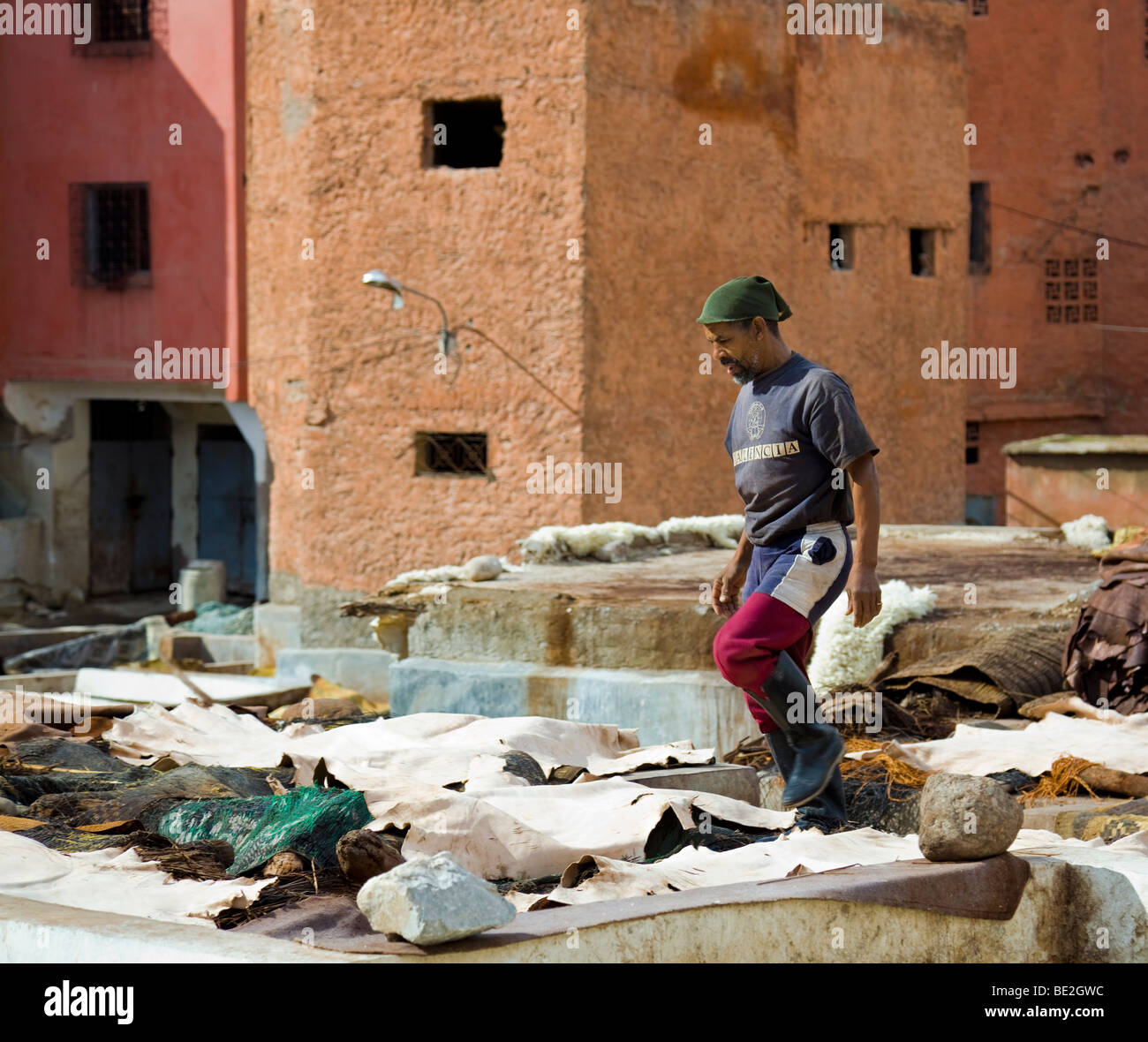Man working in the Arabic Tanneries, Marrakesh, Morocco Stock Photo