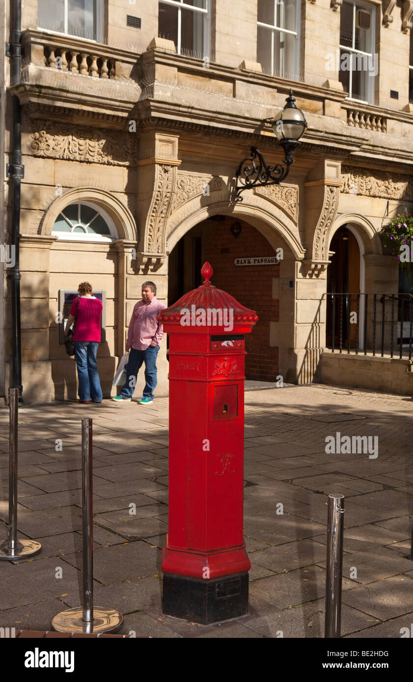 UK, England, Staffordshire, Stafford, Market Square, hexagonal Victorian Pillar box near entrance to Bank Passage Stock Photo
