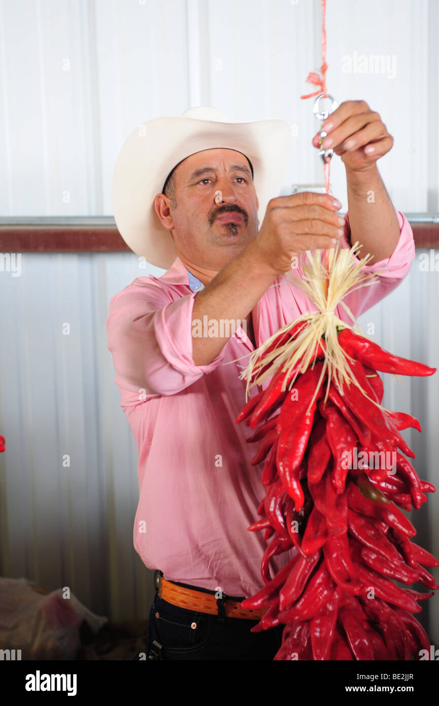 USA Hatch New Mexico Chile FestivalA man in making a ristra of chiles