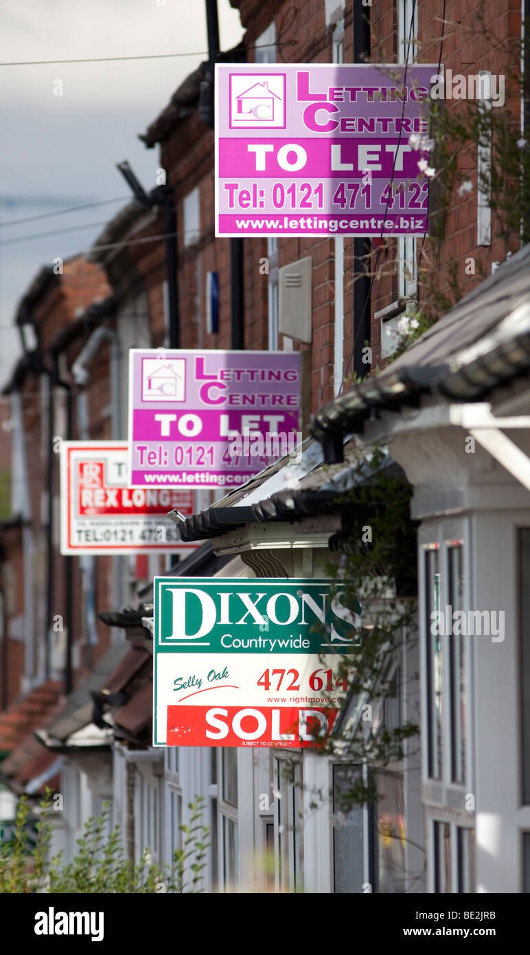 House for sale signs and to let signs on terraced homes in the Selly Oak area of Birmingham, England, UK Stock Photo