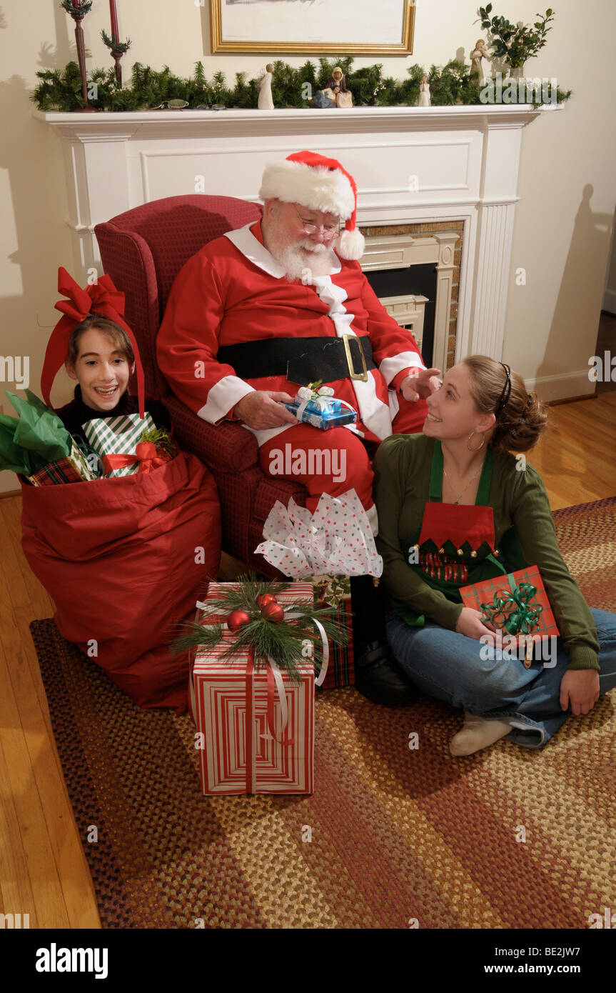 Santa Claus and his helpers. Stock Photo