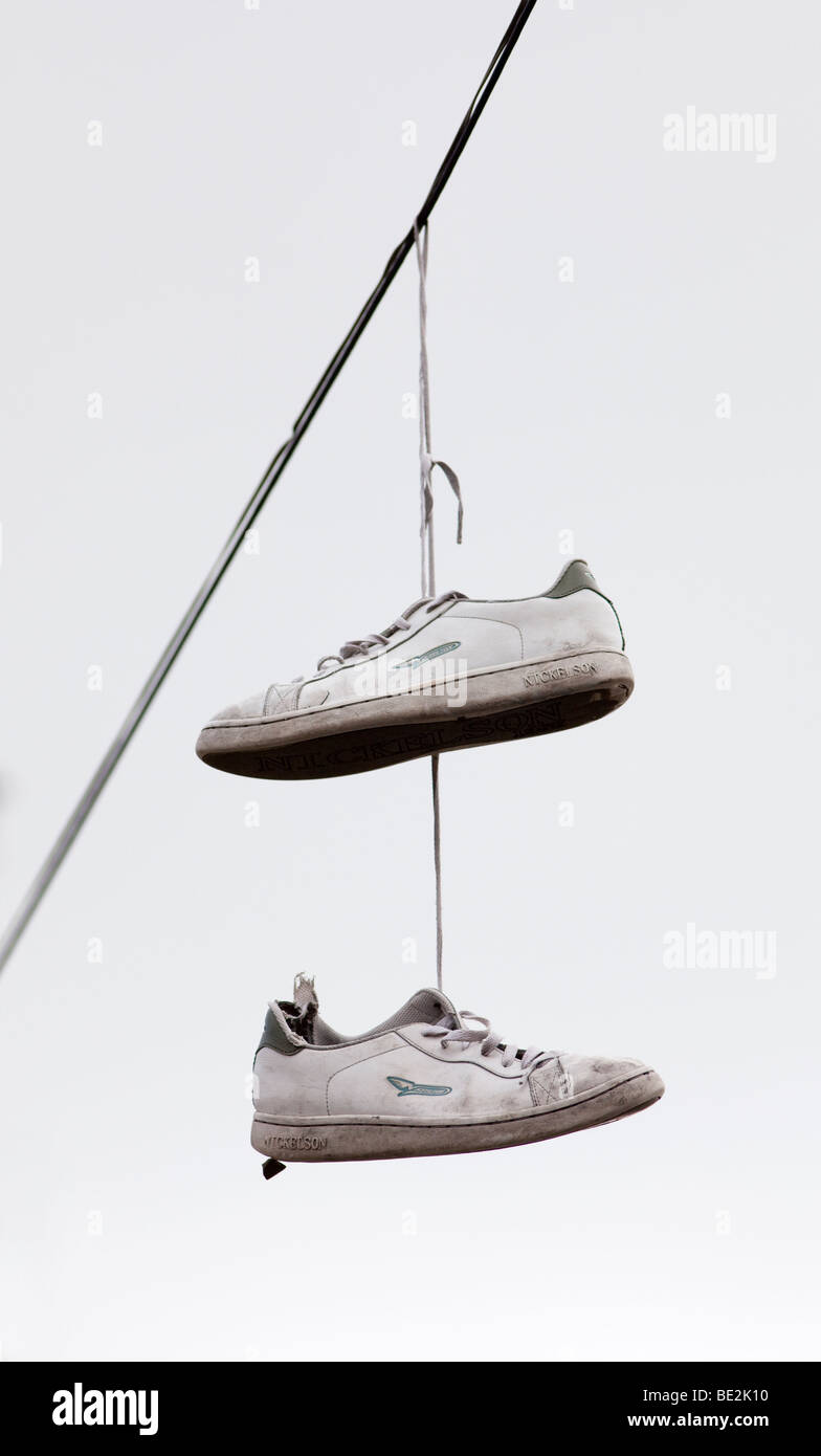 trainers hanging from telephone lines