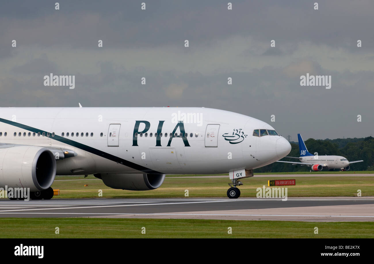 PIA (Pakistan International Airways) aircraft preparing for take off from Manchester Airport (Ringway Airport) Stock Photo