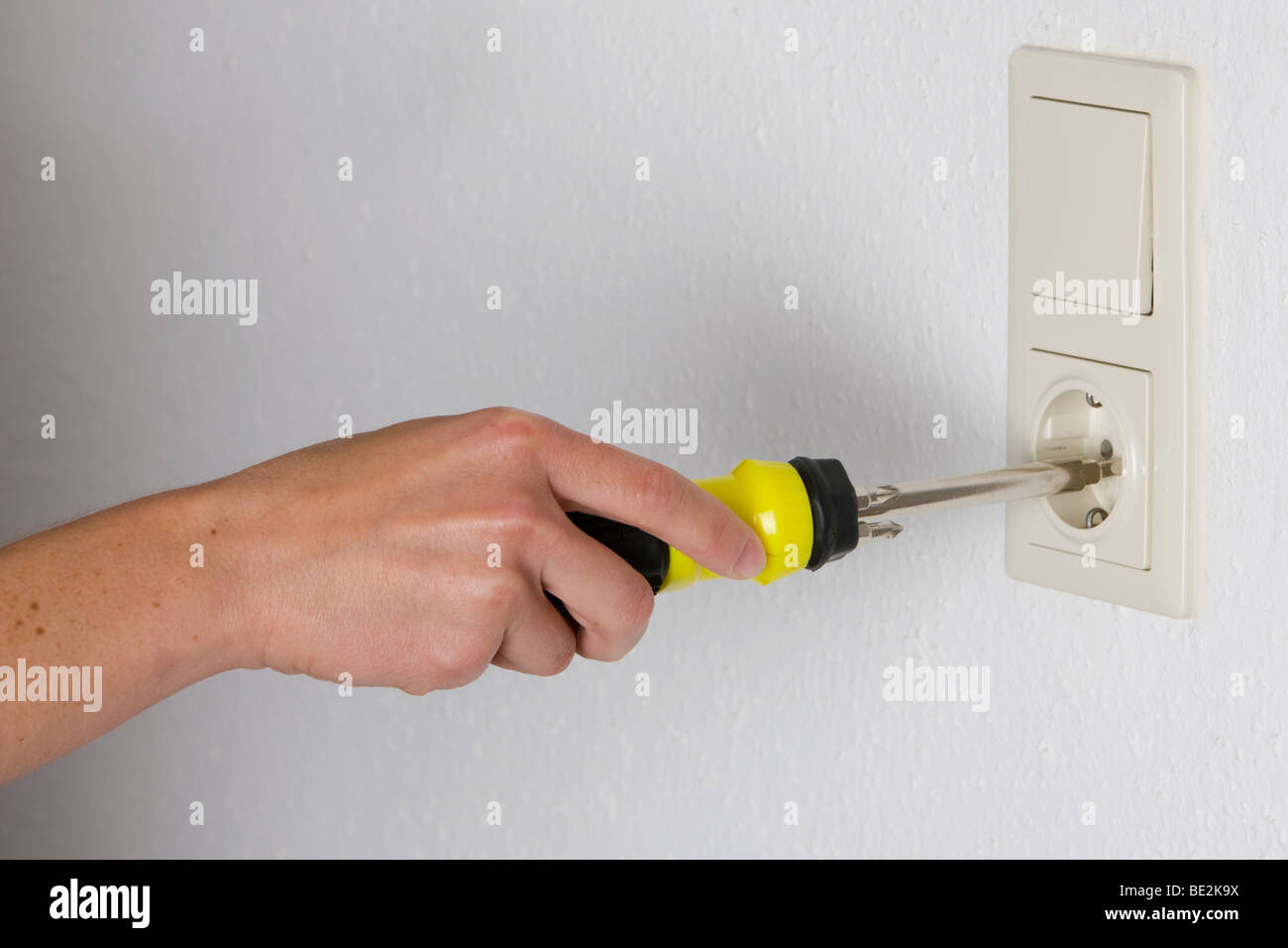 Household accident, screwdriver in a socket Stock Photo