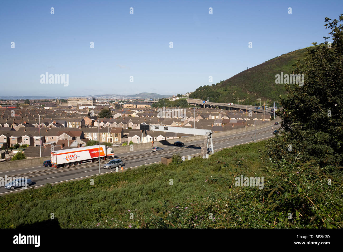 M4 motorway at junction 40 for Port Talbot with mixed traffic