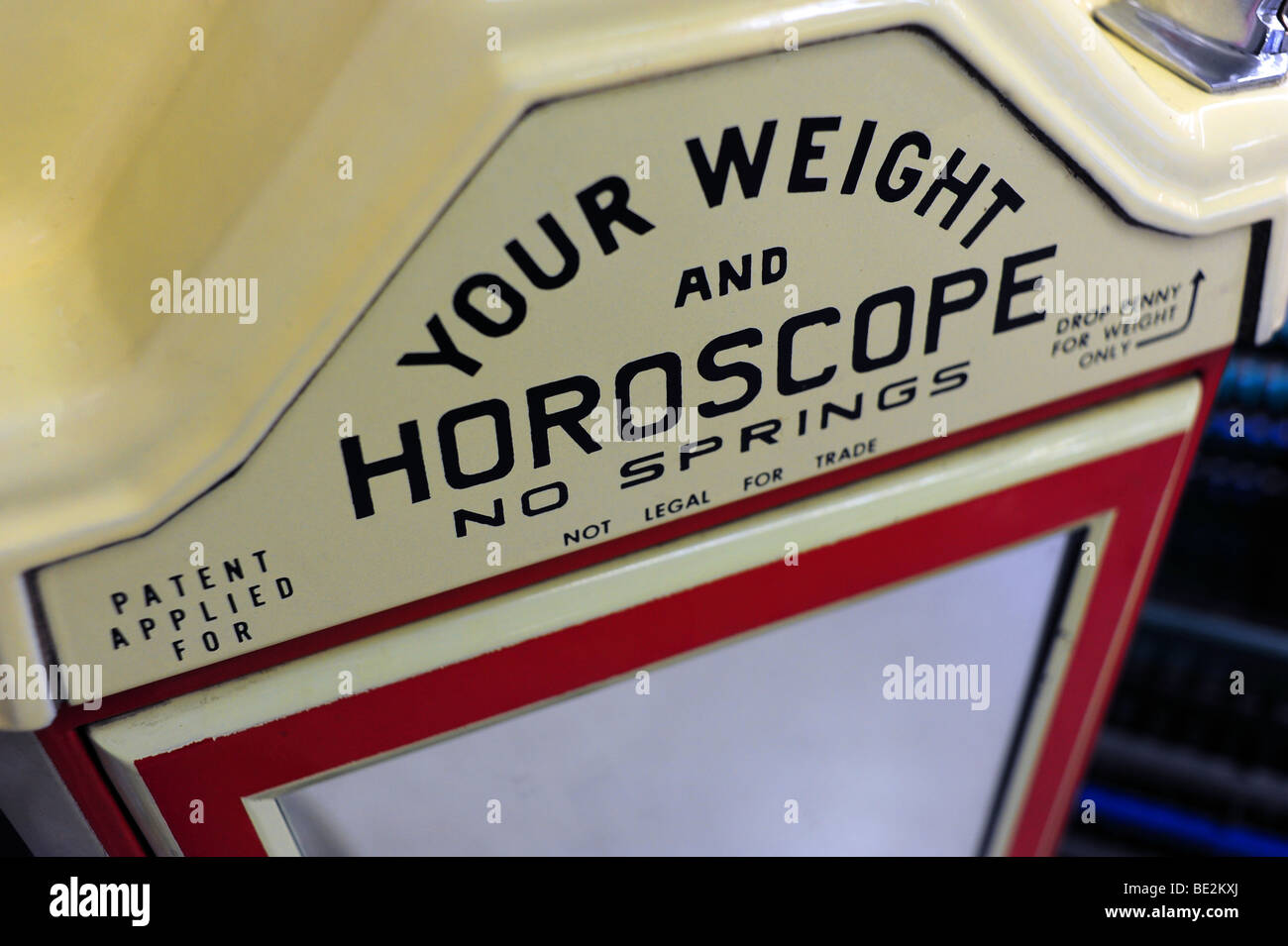 A scale that gives weight and horoscope Stock Photo