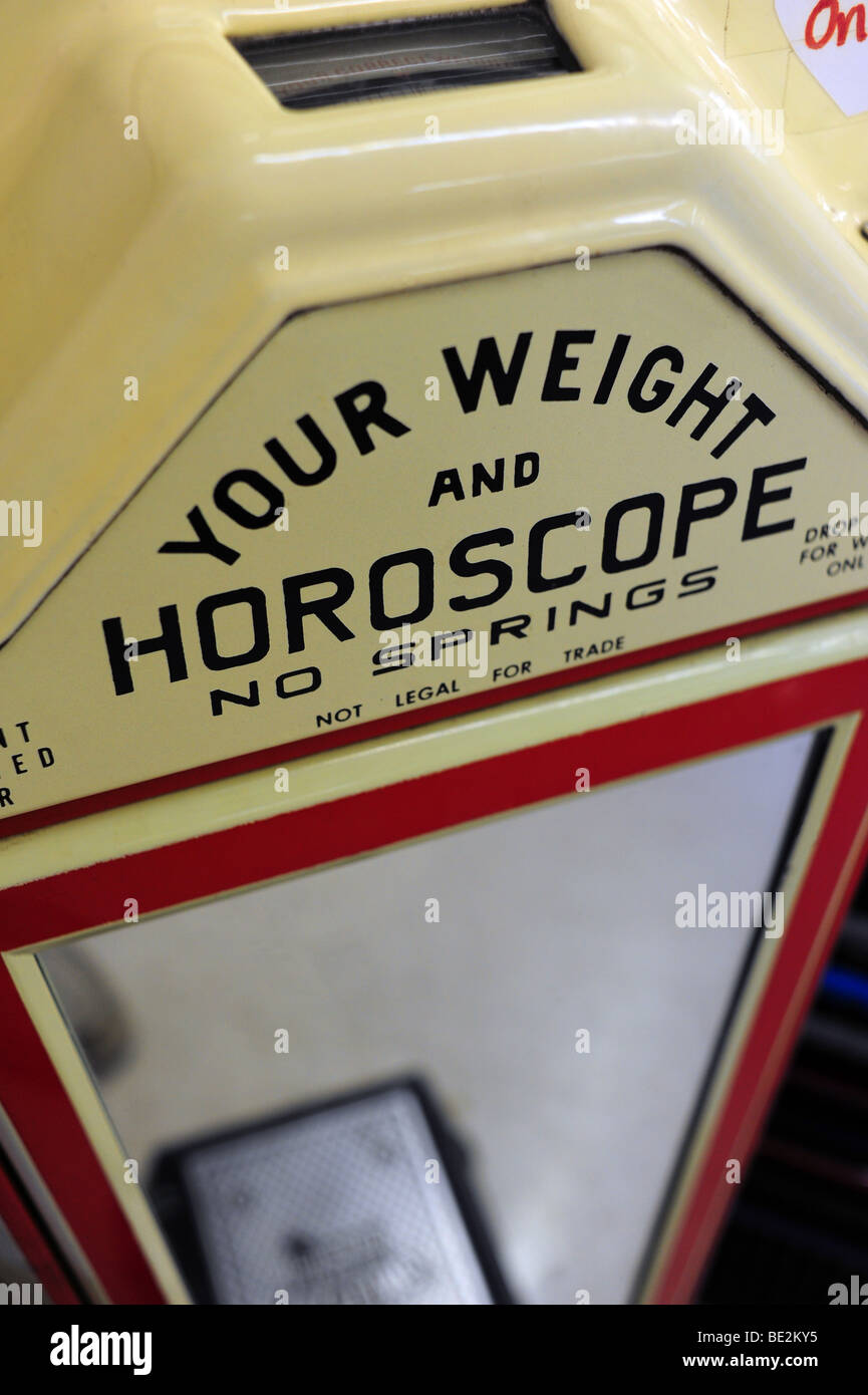 A scale that gives weight and horoscope Stock Photo