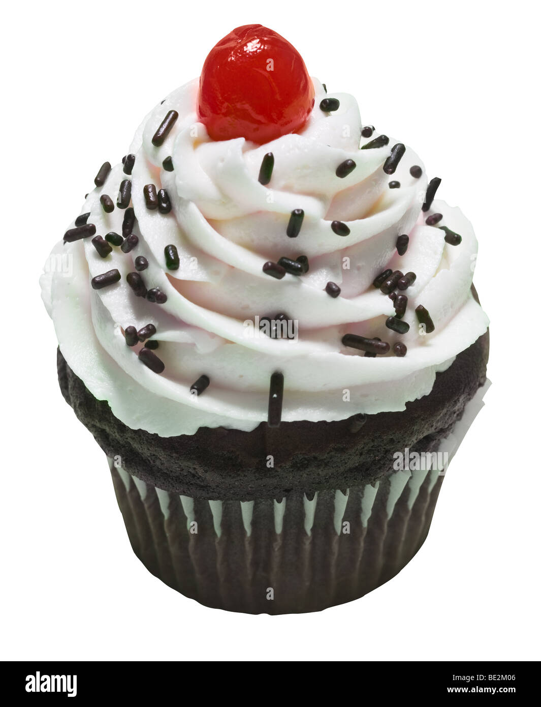 Chocolate Cupcake with Sprinkles and Cherry on top. Stock Photo