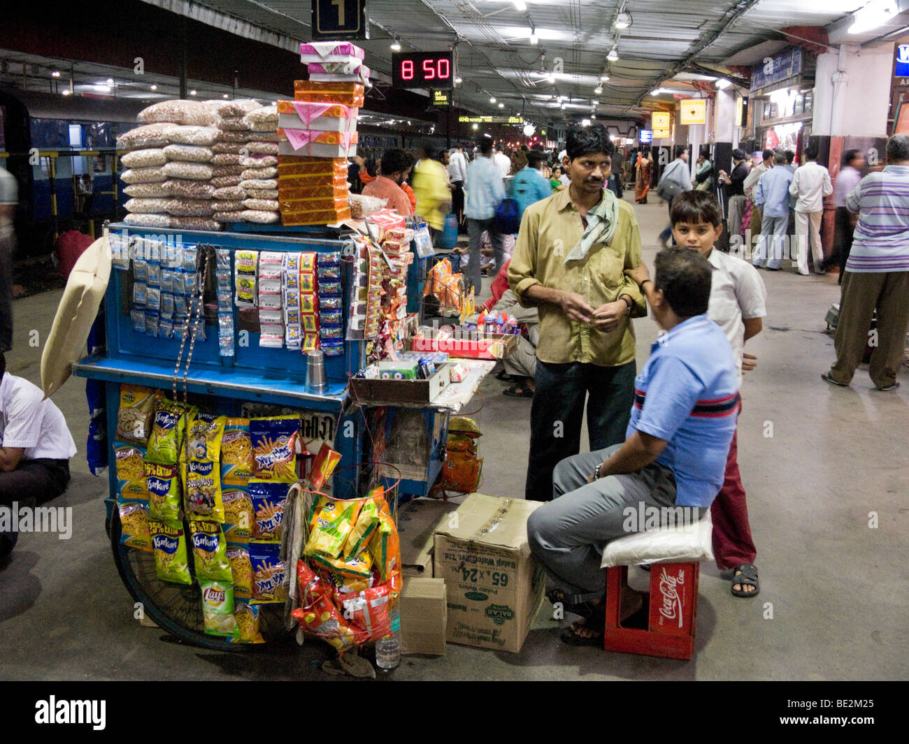 Snack seller with a kiosk on the railway station platform. Surat Stock