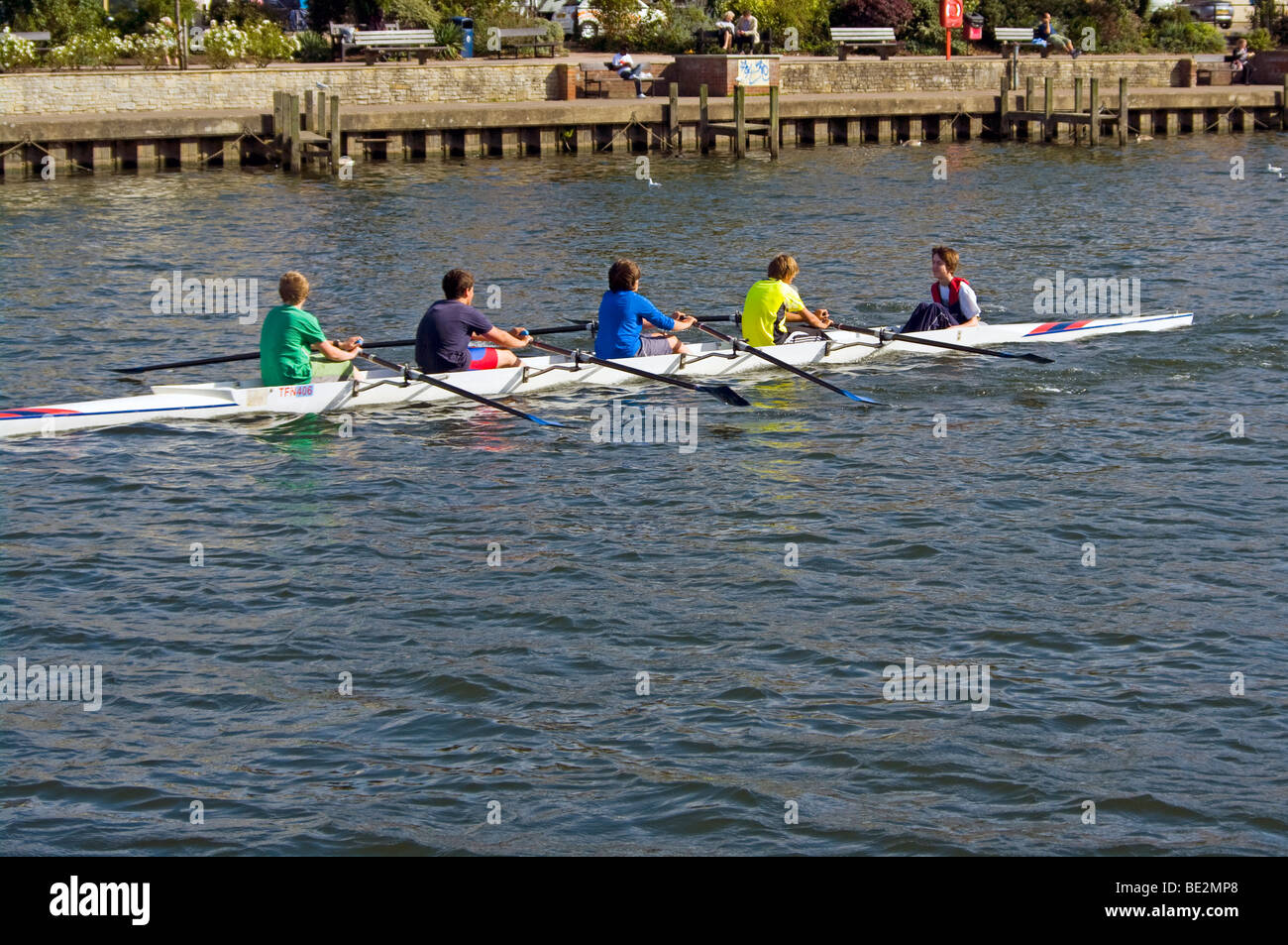 People Rowers Crew Rowing A Coxed 4 Man Scull Boat On The River Thames