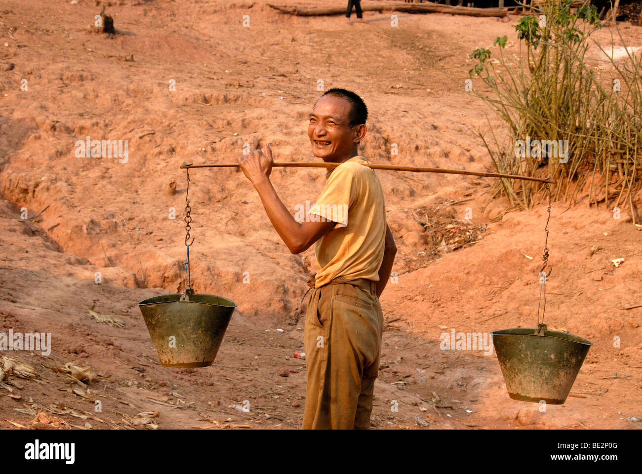 Carrying buckets of water hires stock photography and images Alamy