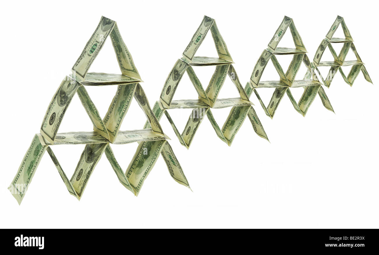 Four pyramids made out of one hundred dollar bills. Stock Photo