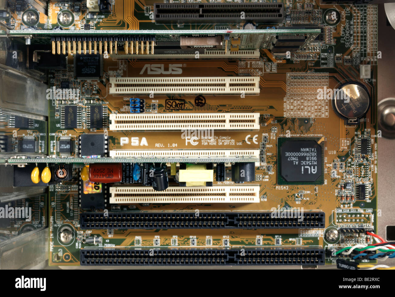 AGP and PCI slots on a motherboard of PC Inside Computer With AGP slot in use Stock Photo