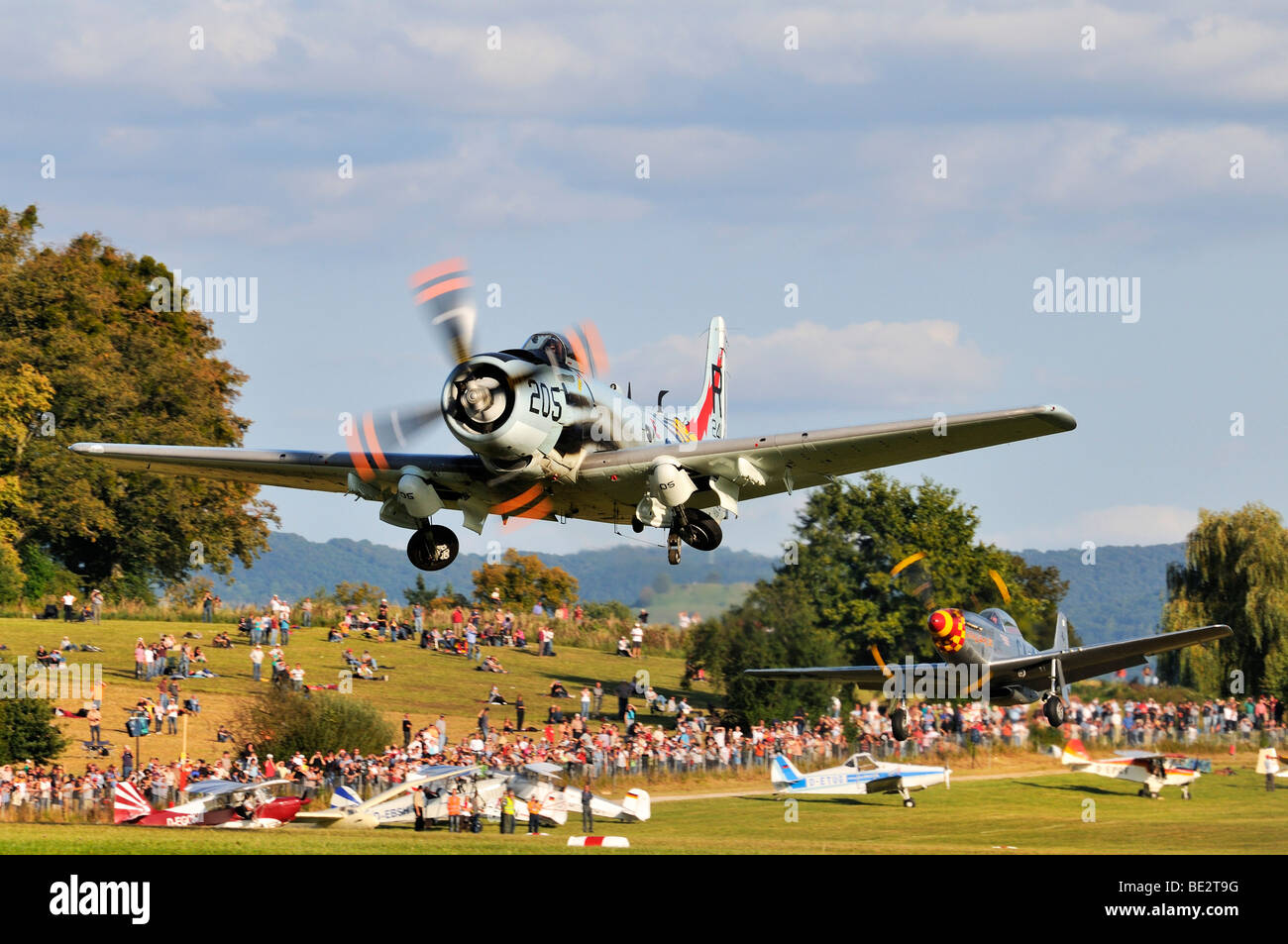 American fighter-bombers Douglas A-1 Skyraider and North American P-51 Mustang immediately after take-off, Europe's largest mee Stock Photo