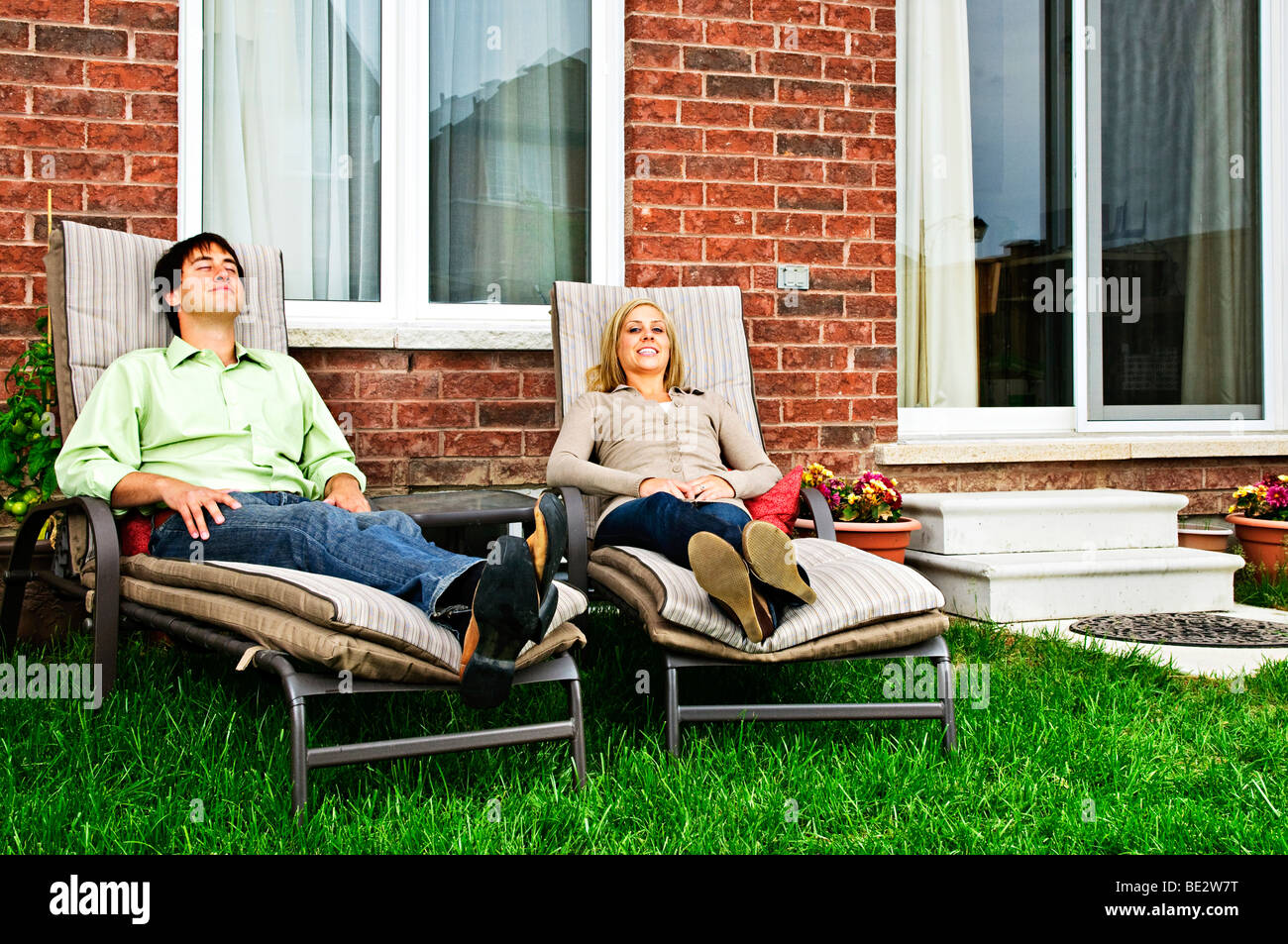 Man laying on lounge chair hi-res stock photography and images - Alamy