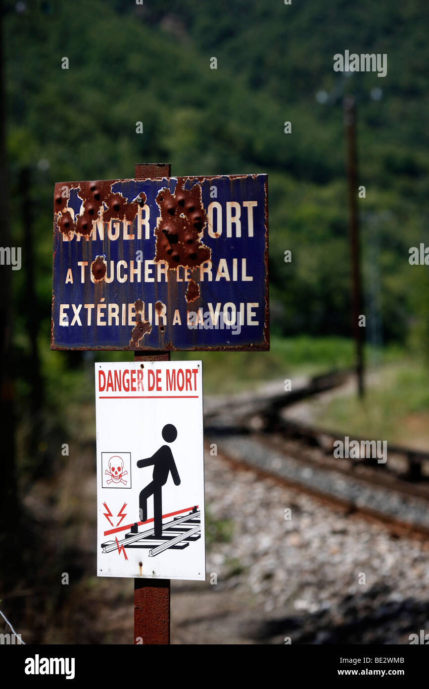 A danger sign on a railway line in France Stock Photo