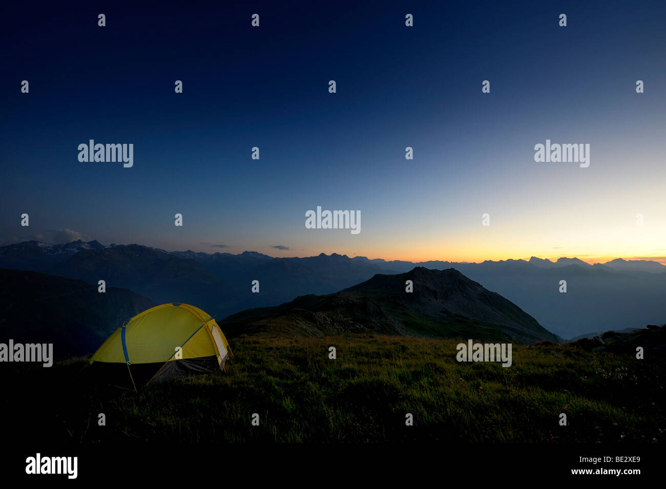Tent in front of a mountain range in the last daylight, Gaschurn, Montafon, Vorarlberg, Austria, Europe Stock Photo