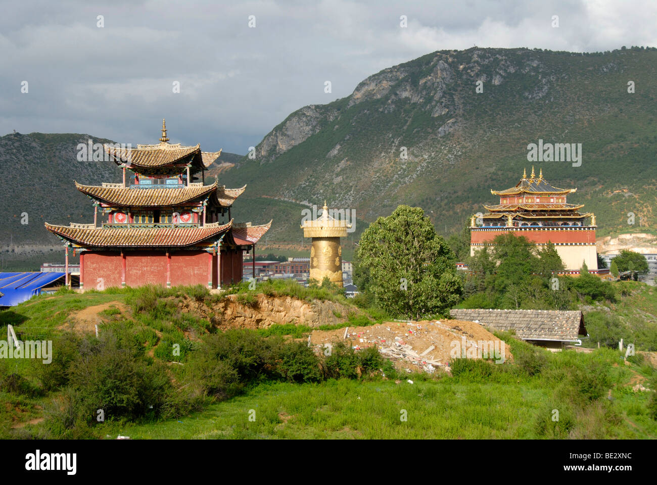 Tibetan Buddhist, monastery, temple and great golden prayer wheel, Guishan Park, Zhongdian, Shangri-La, Yunnan Province, People Stock Photo
