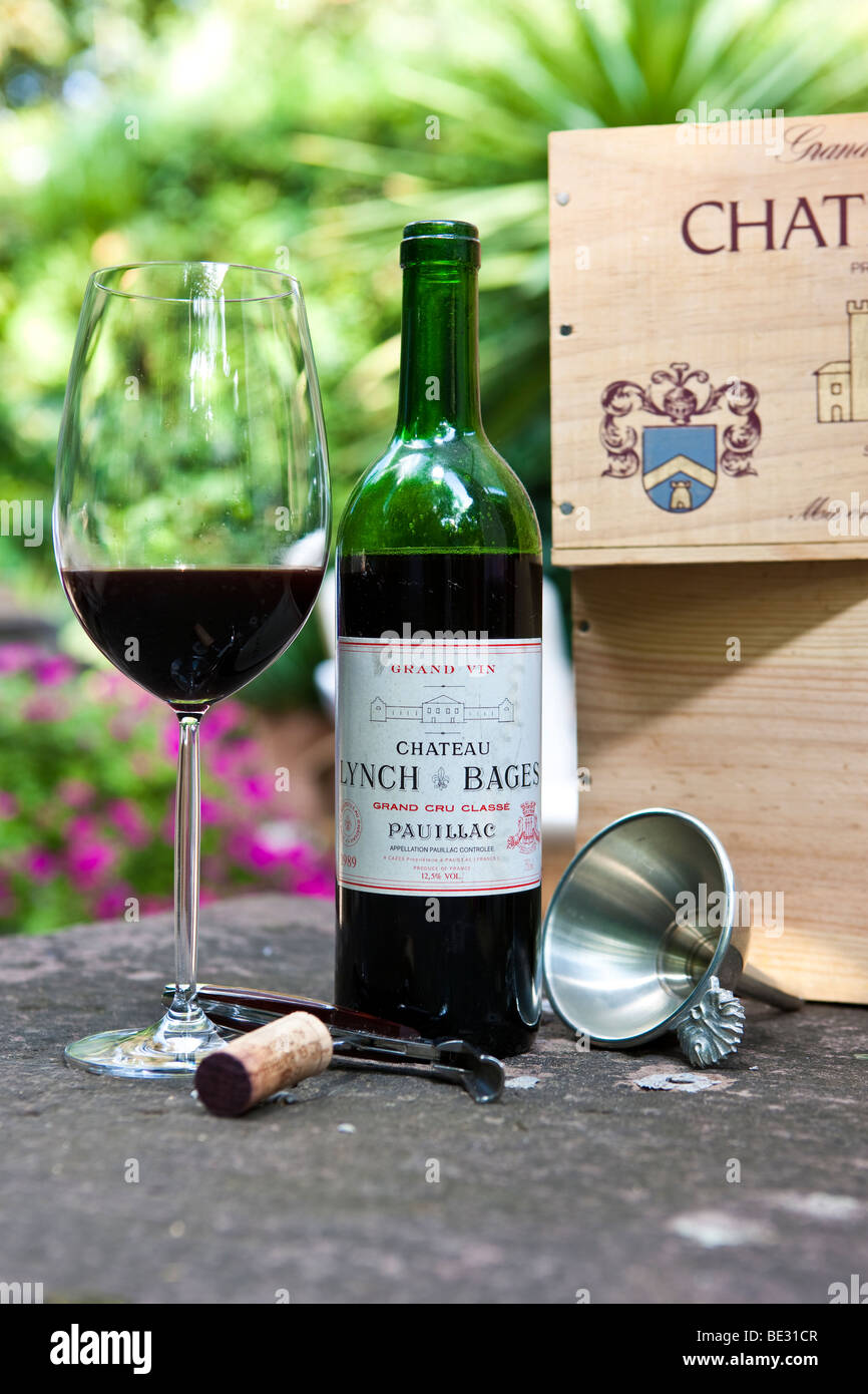 Chateau Lynch Bages, Grand Cru Classe, Pauillac, Grand Vin de Bordeaux, Bordeaux glass, cork, sommelier cutlery Stock Photo