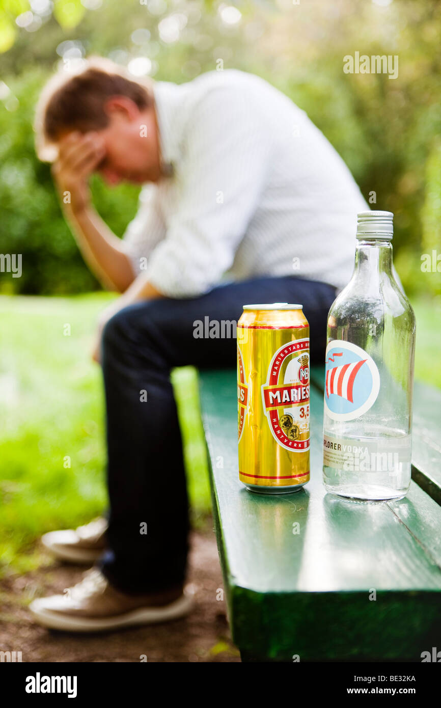 Man sitting with his hand in his face,having problems. Stock Photo