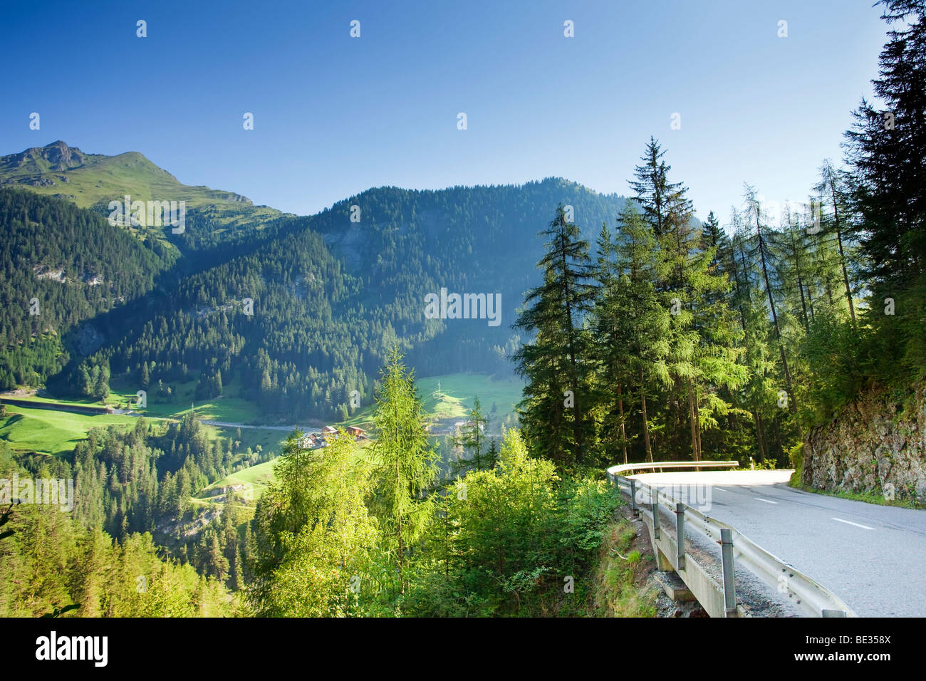 A Road in the swiss alps. Early morning on a mountainous road high in the Swiss Alps. Stock Photo