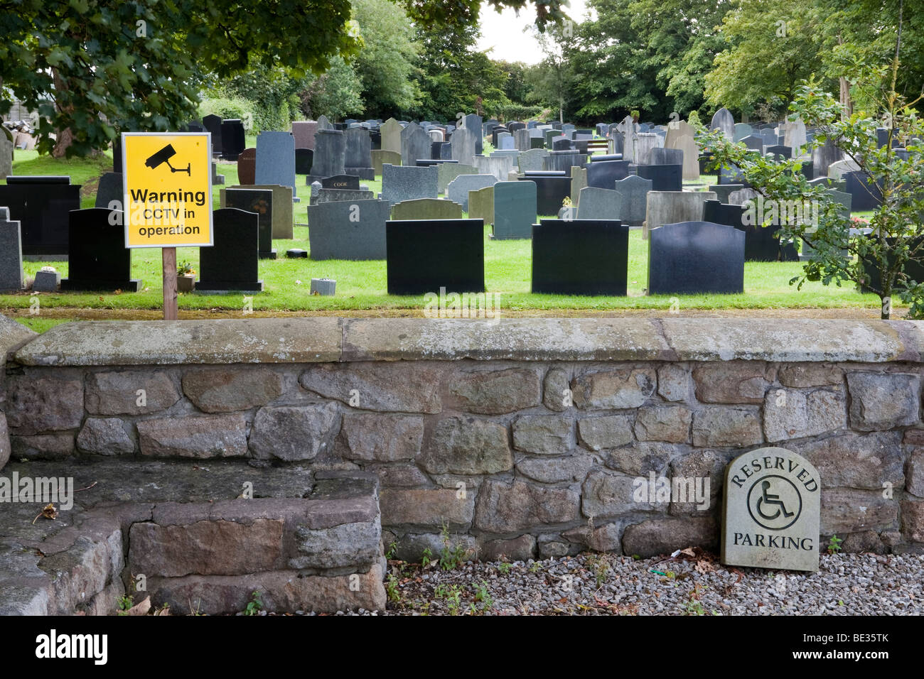Warning CCTV coverage at church yard, graves stones, head stones