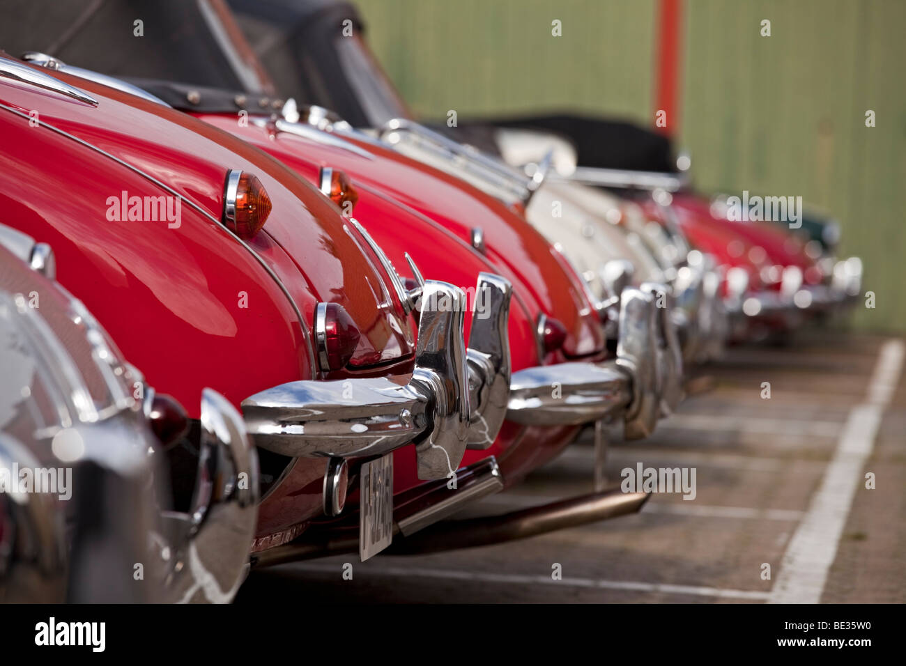 row of bumpers of classical cars Stock Photo