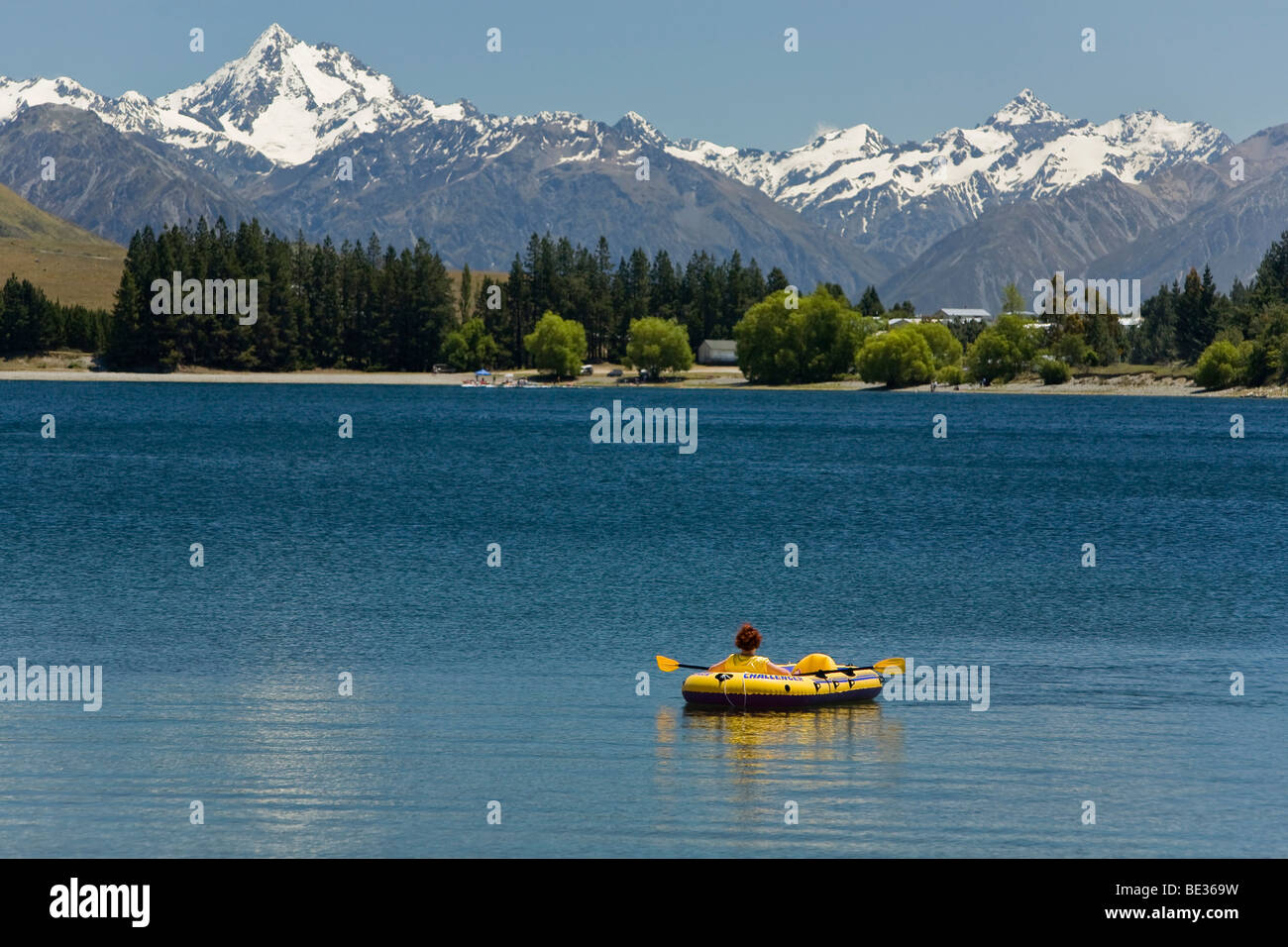 Inflatable boat on Lake Camp with views of the mountains of Cloudy Peak Range, South Island, New Zealand Stock Photo