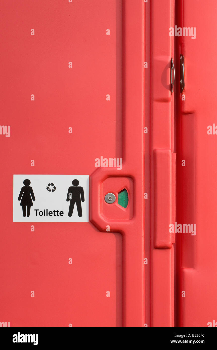 Detail of a red mobile rental toilet Stock Photo