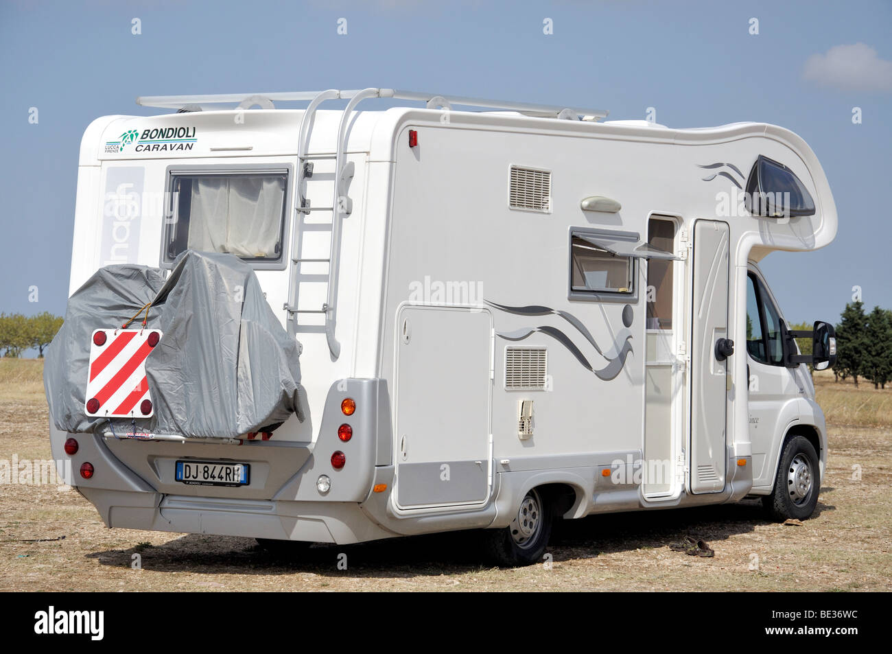 Campervan parked in field, Andria, Barletta-Andria-Trani Province, Puglia Region, Italy Stock Photo