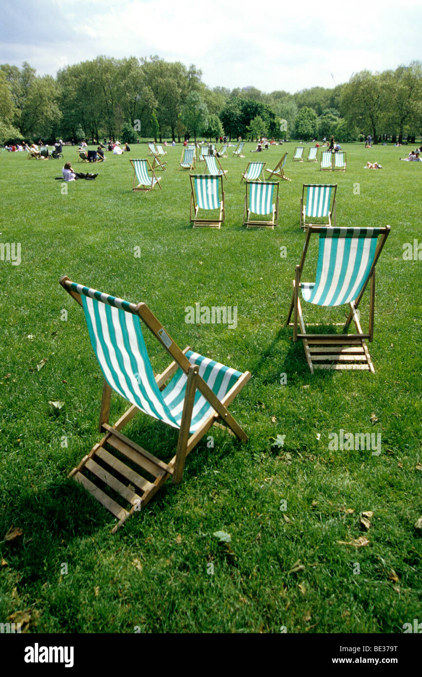 Deck chairs on the grass in Green Park, Ritz Corner, London, England, UK, Europe Stock Photo