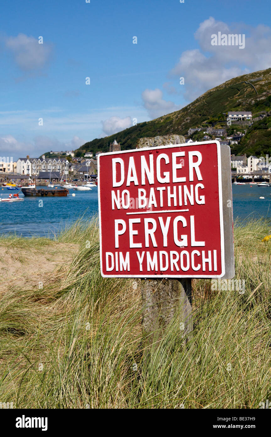 Warning sign for swimmers, Mawddach estuary, Barmouth, Hwynedd, North Wales Stock Photo