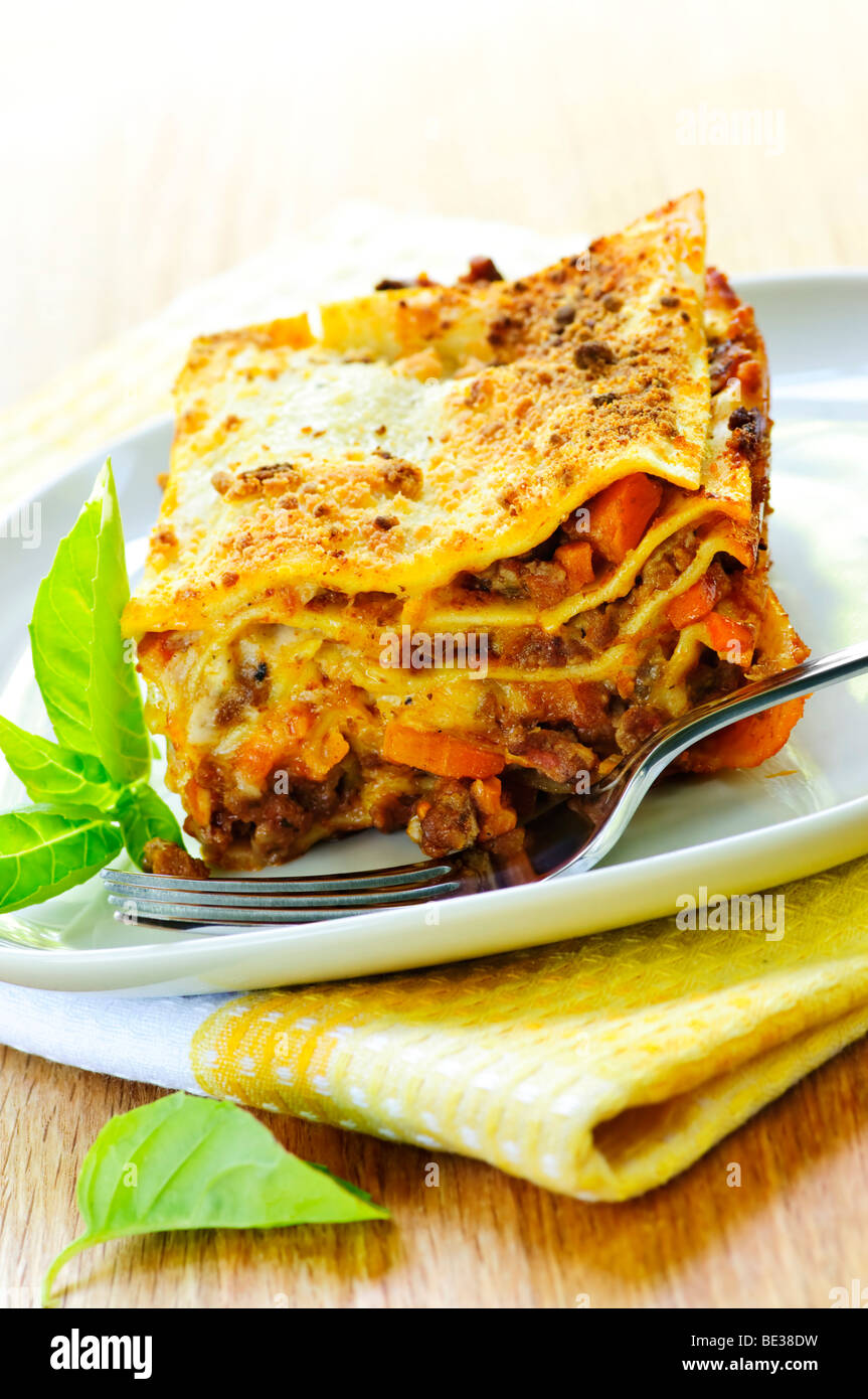 Serving of fresh baked lasagna on a plate Stock Photo
