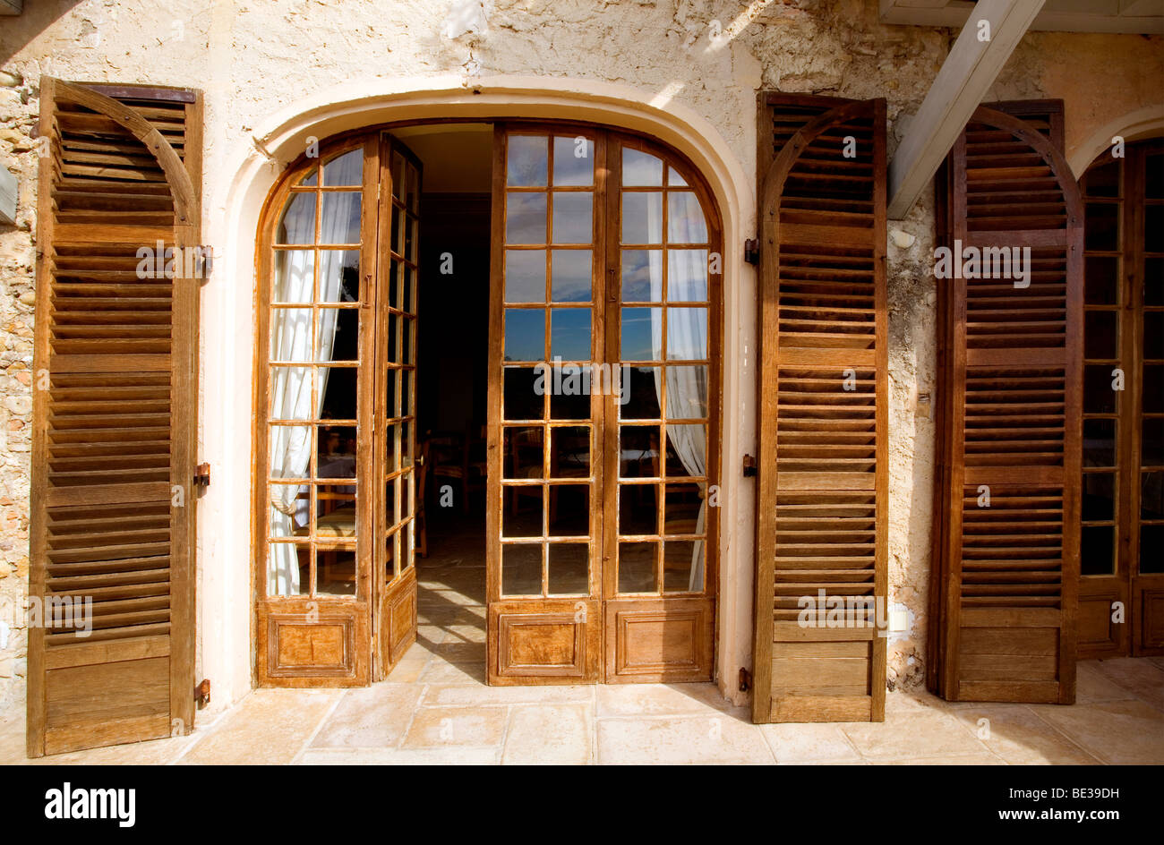 Wooden Shutters and Windows in the town of Cages-sur-Mer on the Cote d'Azur (French Riviera) France Stock Photo