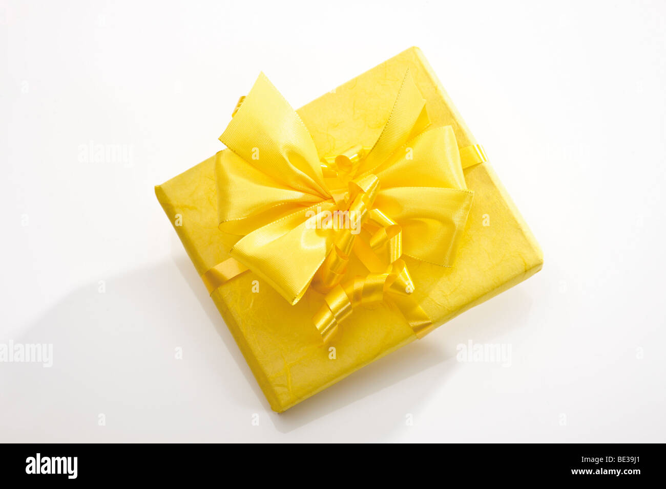 Gift box with a yellow ribbon Stock Photo