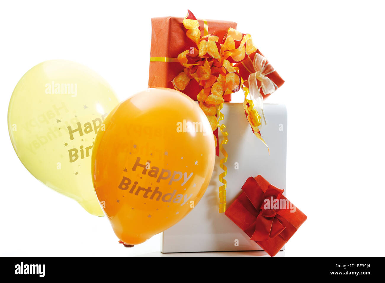 Gift box with a gift ribbon and balloon with the lettering 'Happy Birthday' Stock Photo