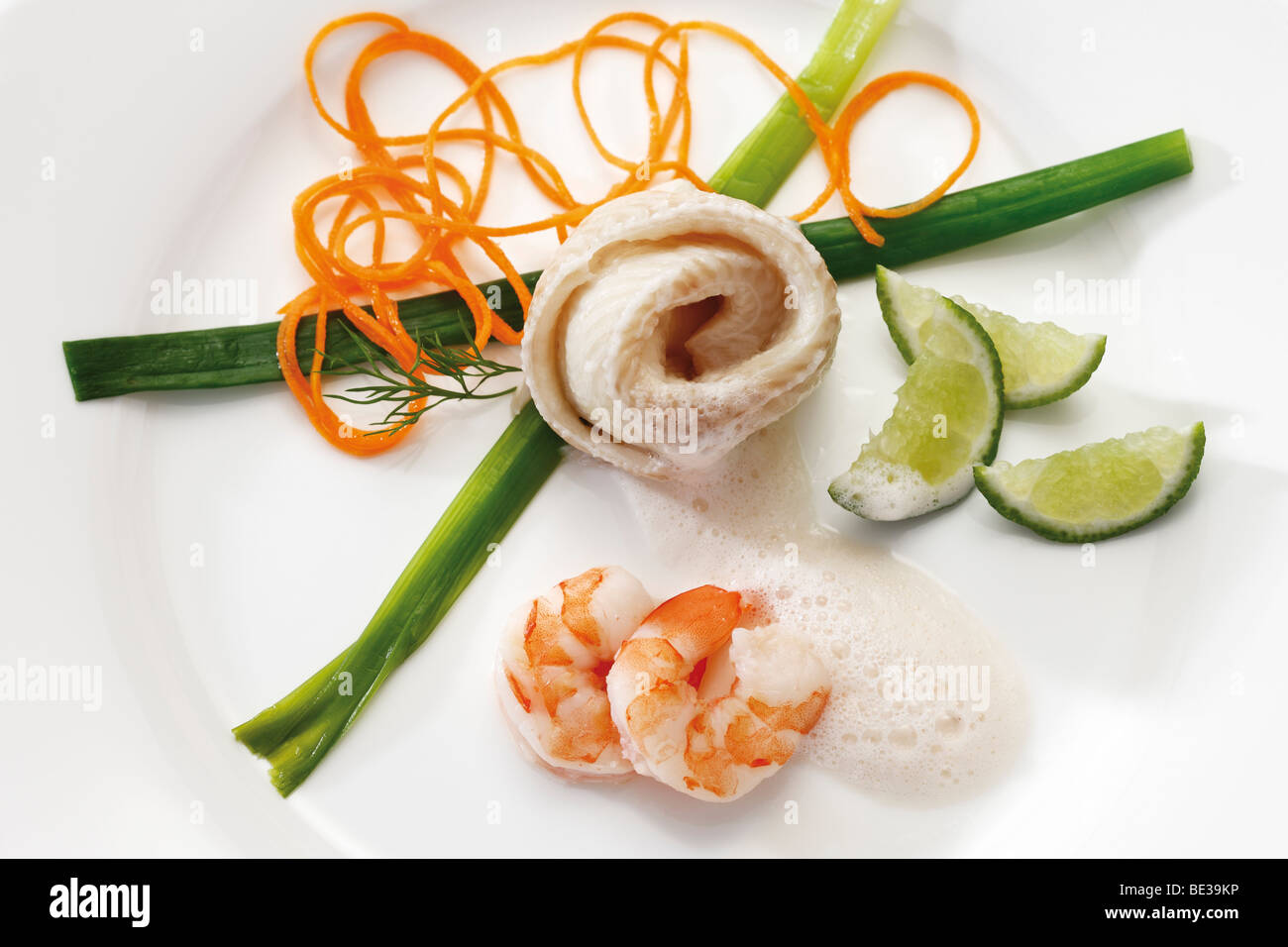 Halibut rolls with scampi and vegetables Stock Photo