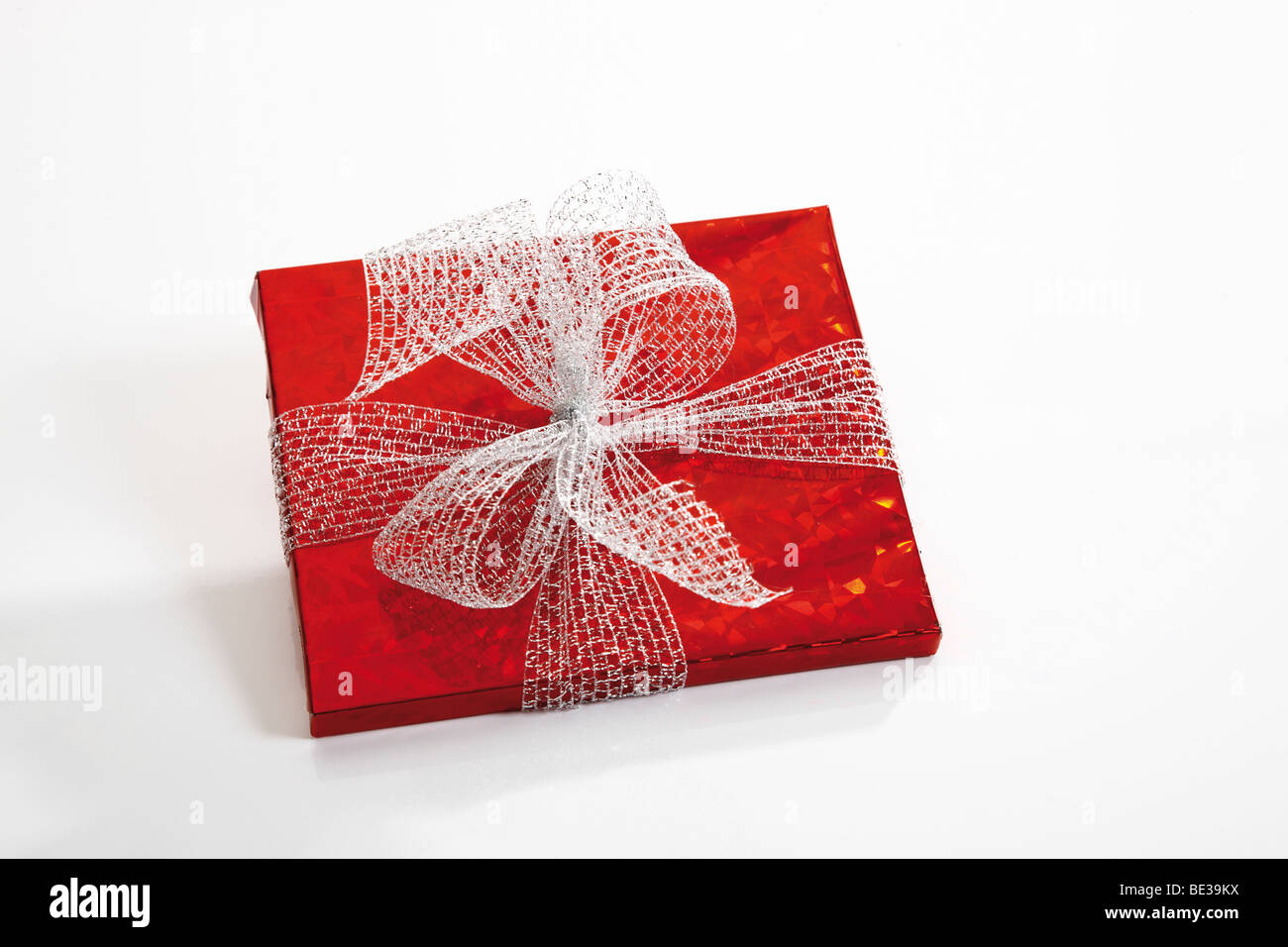 Red gift box with white ribbon Stock Photo